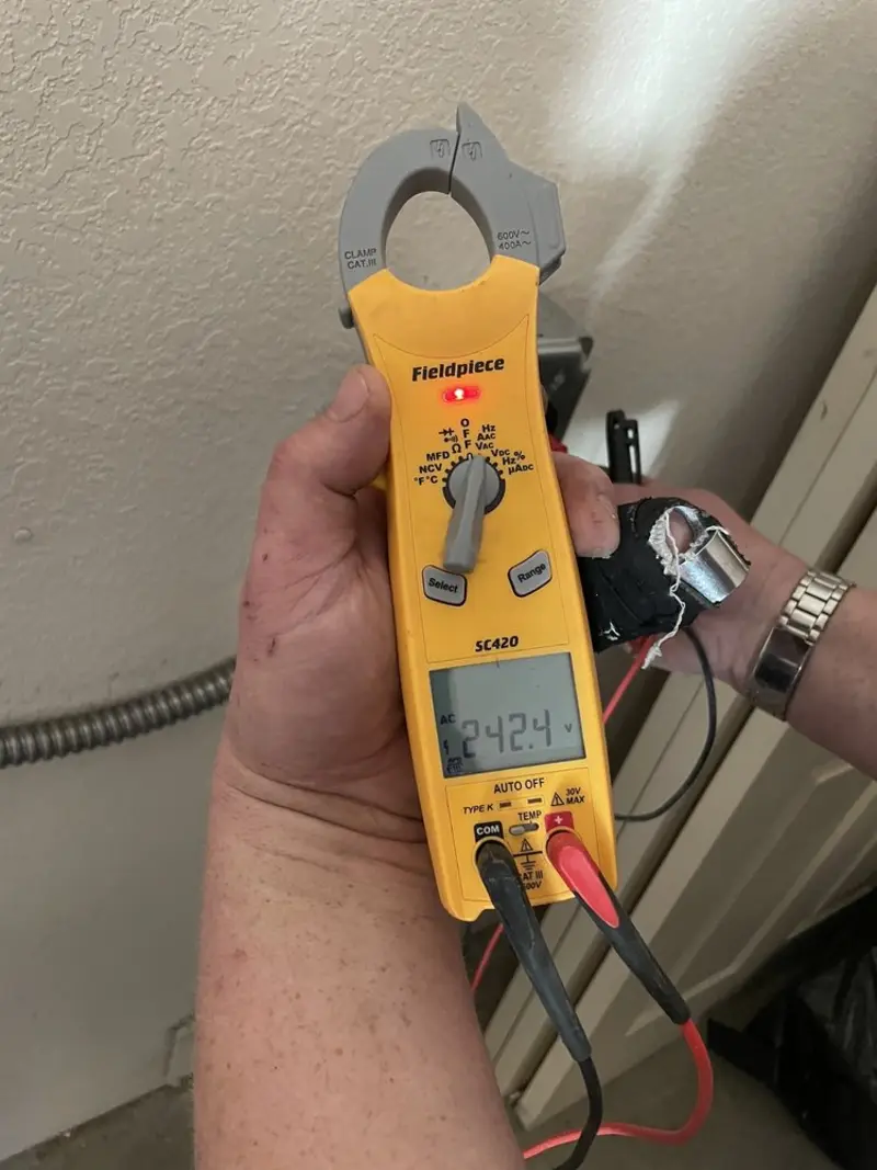 Voltage testing with clamp meter during Ceiling Fan Installation in Glen Rock